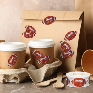 Close-up of holographic American football stickers applied on paper cups and takeaway bags