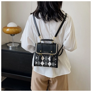 Retro diamond pattern mini backpack shown on model highlighting versatile crossbody styling