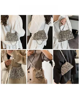 Detail view of silver metal mesh weave shoulder bag with reflective sequins