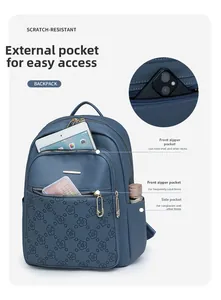 Detail showing scratch-resistant blue floral backpack with multiple zip pockets for iPad
