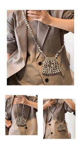 Macro detail of metallic silver bead woven mesh on stylish crossbody mini shoulder bag