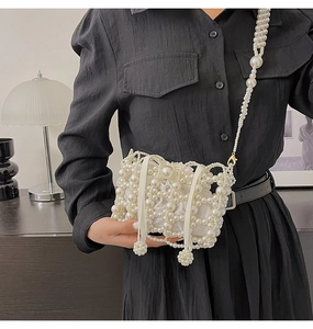 Detailed close-up of a handmade pearl woven bucket bag with satin drawstring liner