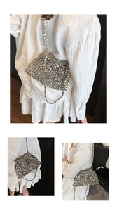 Detailed close-up showing silver metallic sequins and woven bead texture of the handbag