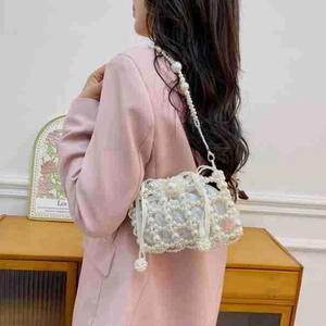 Elegant French vintage pearl beaded bucket bag with woven straps and inner pouch