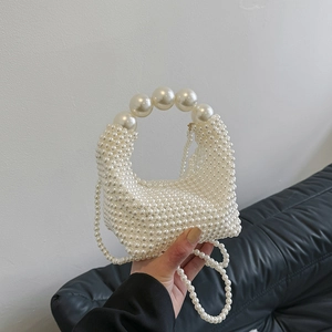 Handmade pearl beaded handbag with oversized pearl handle and detachable crossbody strap