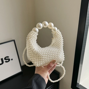 Elegant white faux pearl beaded handbag with circular handle and long chain strap