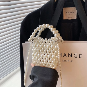 Miniature handmade white faux pearl handbag with circular handle and chain strap for women