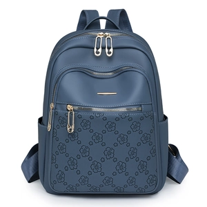 Navy blue women's fashion backpack with floral print and unique safety pin zippers