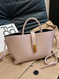 Chic pink pebble leather tote bag with vintage gold oval lock and adjustable strap
