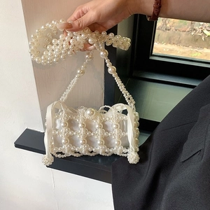Handmade white pearl beaded bag with satin lining and shoulder strap for women