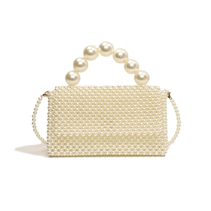 Elegant white handmade pearl handbag with beaded handle and shoulder strap for weddings