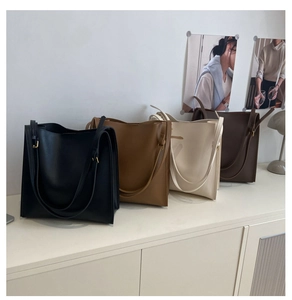 Detailed comparison of four solid color square tote bags in synthetic leather with gold buckles