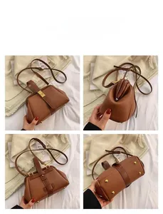Detailed views of caramel brown lychee texture leather handbag with vintage metal clasp