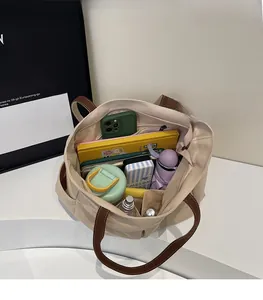 Top view of spacious canvas tote interior showing organization of daily essentials