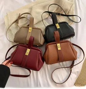 Flat lay of litchi grain leather handbags in beige, black, wine red, and tan colors