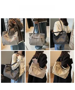 Multi-pocket canvas tote bags in four colors shown with leather handles and large capacity