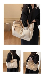 Detail of large canvas tote bag showing side pocket and spacious interior for A4 items