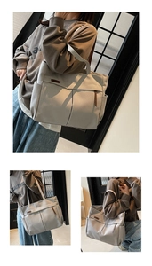 Detailed view of grey canvas tote bag with side pockets and stylish leather accents