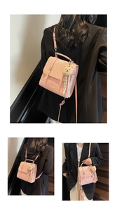 Pink glossy patent leather crossbody bag with cute bear charm and striped tassel detail
