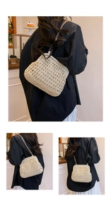 Detail of beige woven straw shell bag with gold chain strap and metal clasp closure