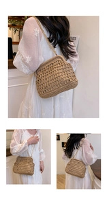 Detail of khaki woven straw bag with retro clasp and detachable gold metal chain strap