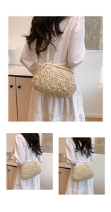 Detail of hand-woven straw bag with vintage metal clasp and elegant chain strap