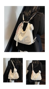 Detail of creamy white glossy shoulder bag with woven tassel and round coin purse accessory