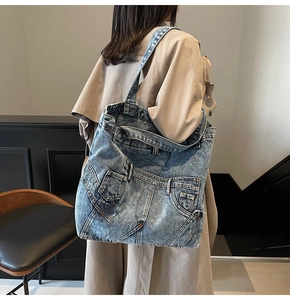 Model view of large vintage washed denim tote bag showing spacious capacity and retro style