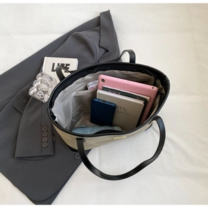 Detailed top view of large capacity tote bag showing spacious interior with storage space