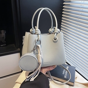 Light blue lychee pattern leather bucket bag with a round coin pouch and shoulder strap
