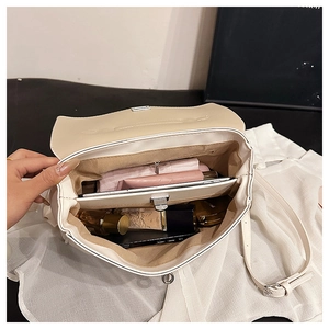 Internal view of cream tote bag showing spacious compartments with daily essentials