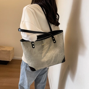 Minimalist grey marble texture tote bag for women with black straps and gold accents