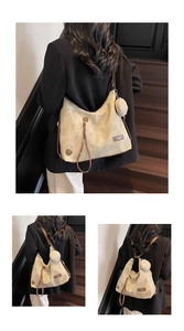 Detail of canvas tote bag with brown leather trim and matching round mini pouch