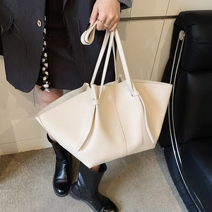 Chic cream white large trapezoid tote bag with wing silhouette and leather texture