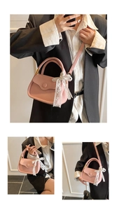 Pink lychee textured leather crossbody bag with lace bow and versatile styling options