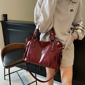 Retro burgundy PU leather tote bag with rivet details and adjustable shoulder strap