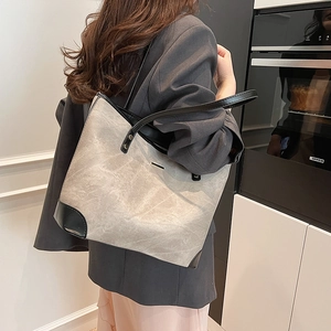 Minimalist marble pattern tote bag with black trim and shoulder straps for women