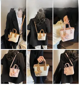 Detailed model views of stylish bucket bag with cute plush puppy charm and strap