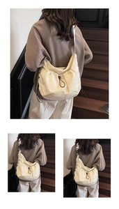 Detail of a cream-white nylon crossbody bag featuring stylish drawstring fold design