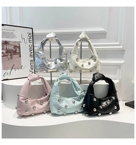 Detailed display of five colorful hobo bags featuring metallic studs and knotted handles
