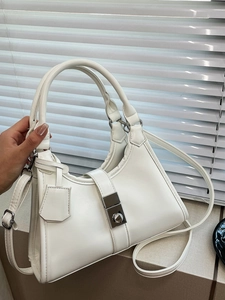White ruched dumpling handbag with silver metal buckle and curved top handle for women