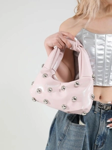 Pink glossy hobo underarm bag with oversized silver mirror-polished metal rivets