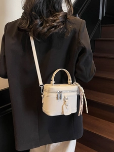Elegant cream white lychee leather handbag with detachable strap in a minimalist box style