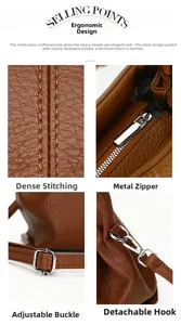 Detail of brown lychee leather handbag showing neat stitching and metal zipper hardware