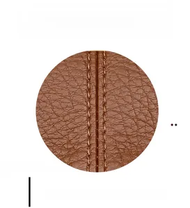 Detailed close-up of reinforced stitching on brown leather cloud handbag handle