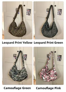 Detailed grid view of large canvas crossbody bags in leopard and camo patterns