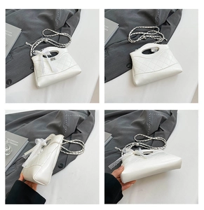 Detailed views of white quilted chain handbag with lace bow and metal twist lock