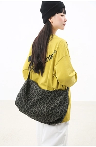 Detail view of large leopard print canvas tote bag with spacious interior for daily use