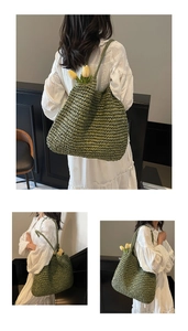Detail of hand-woven green straw tote bag with textured patterns and long shoulder straps