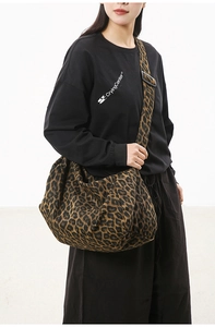 Leopard print canvas crossbody bag with adjustable wide strap and large capacity